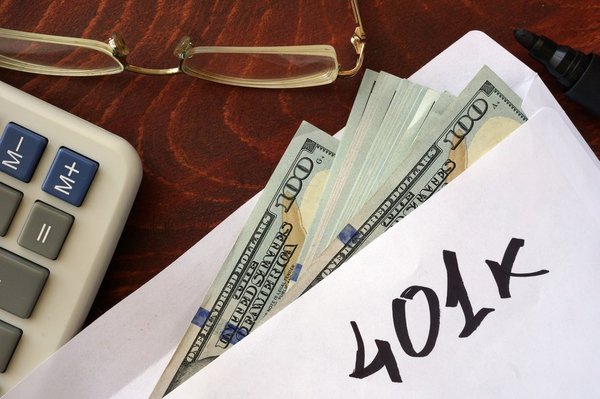 A cash-stuffed envelope with 401K written on it.